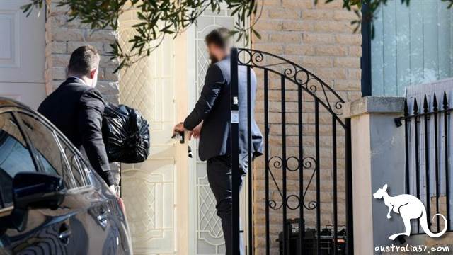 Federal officers enter the home of NSW Labor MP Shaoquett Moselmane in Rockdale, Sydney on Friday morning. Picture: Bianca De Marchi/AAP