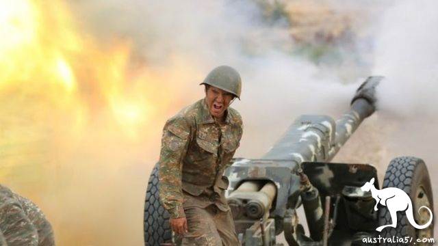 An ethnic Armenian soldier fires an artillery piece in Nagorno-Karabakh. Photo: 29 September 2020